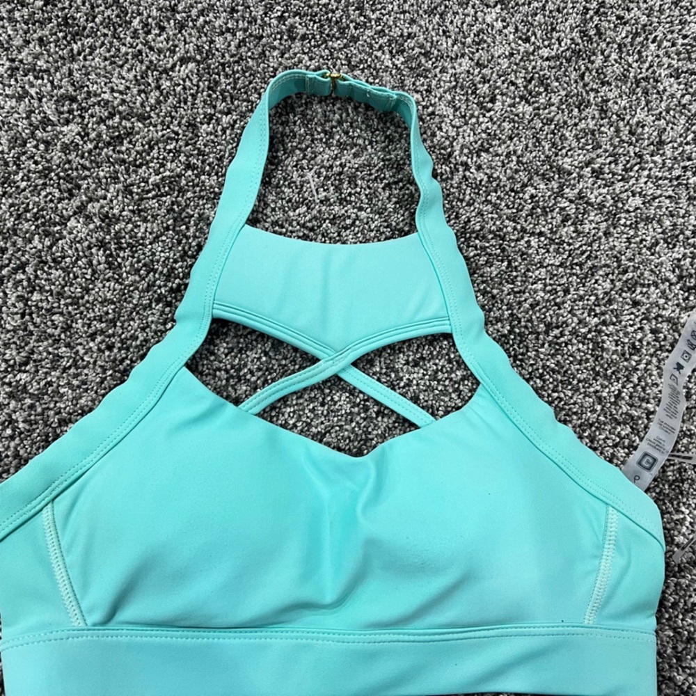 Chestee size 6 sports bra- fits like a small. Has collar bone padding.